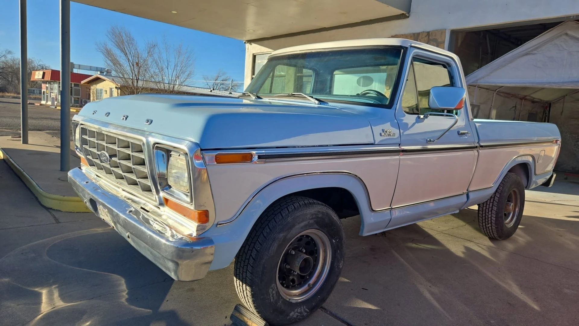 Restored classic Ford F-100 in custom light blue and white two-tone paint