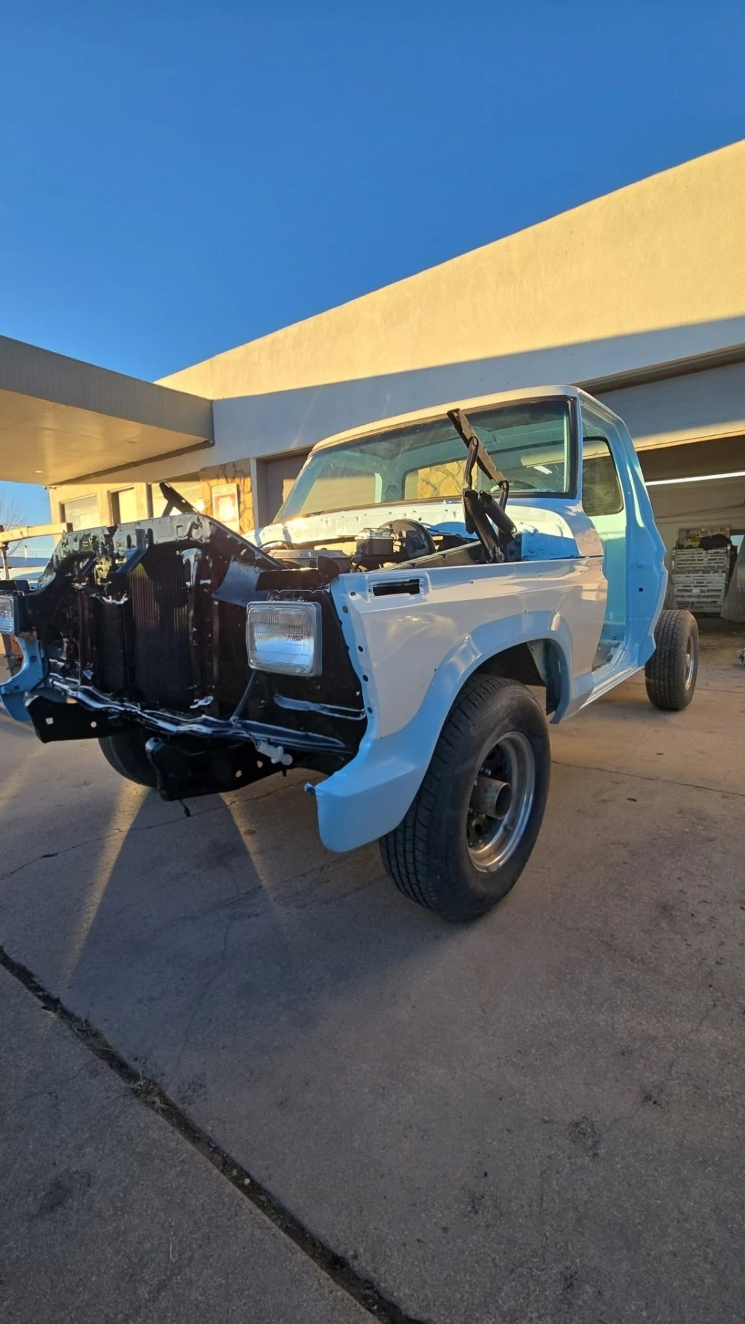 Classic Ford F-100 stripped down in primer during restoration